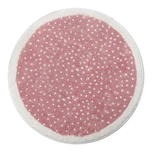 Round pink carpet with big white polka dots for a girl's bedroom