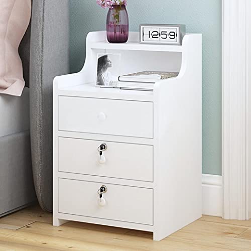 White wooden bedside table with several drawers with key